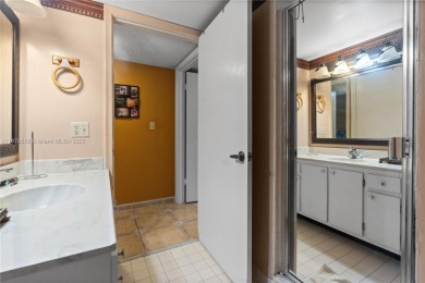 Step into luxury with this elegant condo in a quiet, gated