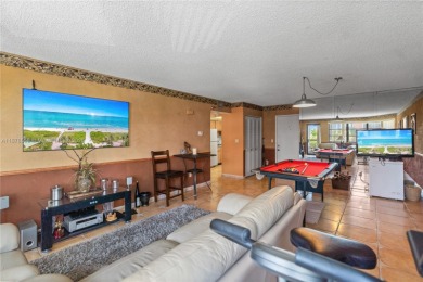 Step into luxury with this elegant condo in a quiet, gated