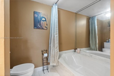 Step into luxury with this elegant condo in a quiet, gated