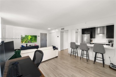 Completely remodeled 1/1 corner penthouse in the gated Nirvana