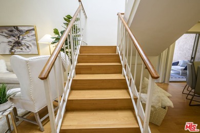 Come to see this recently refreshed townhome with the rare lake