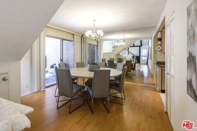 Come to see this recently refreshed townhome with the rare lake