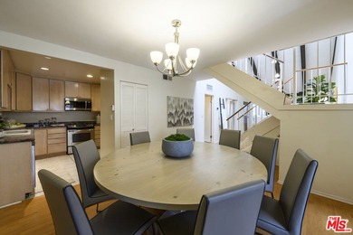 Come to see this recently refreshed townhome with the rare lake