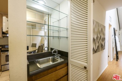 Come to see this recently refreshed townhome with the rare lake