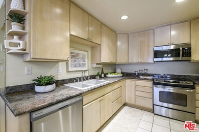 Come to see this recently refreshed townhome with the rare lake