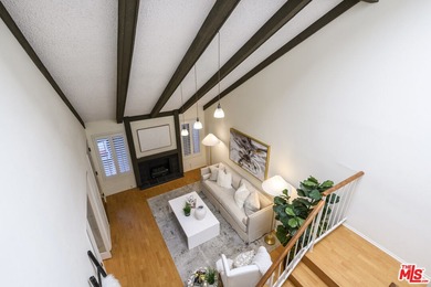 Come to see this recently refreshed townhome with the rare lake