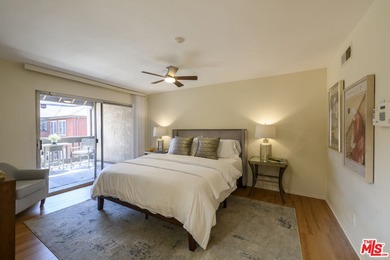 Come to see this recently refreshed townhome with the rare lake