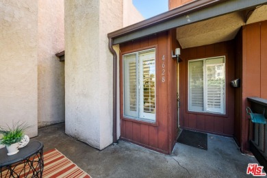 Come to see this recently refreshed townhome with the rare lake