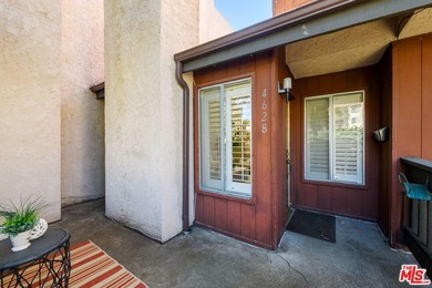 Come to see this recently refreshed townhome with the rare lake