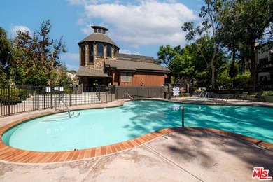 Come to see this recently refreshed townhome with the rare lake