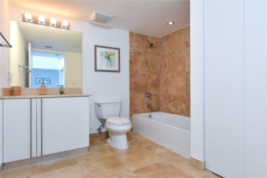 Rarely available 4-bedroom, 4-bath two-story condo with soaring