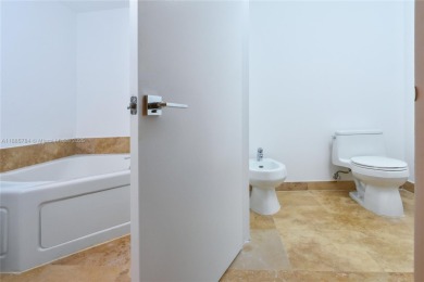 Rarely available 4-bedroom, 4-bath two-story condo with soaring