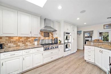 Spectacular single-level split-wing home featuring 4 bedrooms