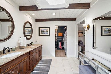 Spectacular single-level split-wing home featuring 4 bedrooms