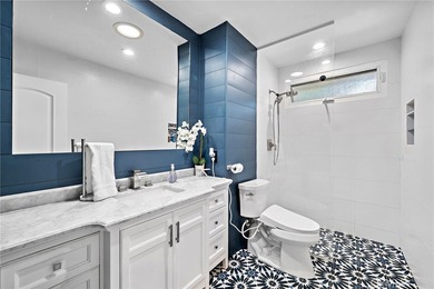 Spectacular single-level split-wing home featuring 4 bedrooms