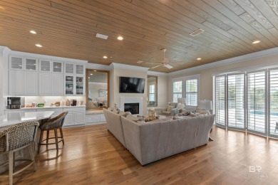 Just steps from the sugar-white sands of the Gulf, this