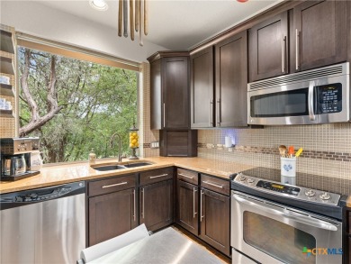 Experience lake living at its finest in this beautifully updated