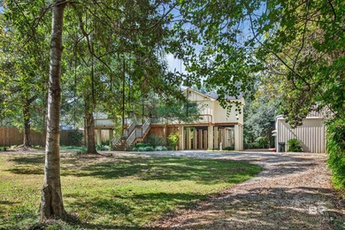 Welcome to this stunning waterfront retreat in Summerdale that