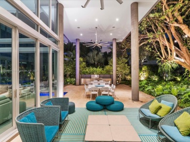 Set on prestigious Rio Vista Boulevard, this modern estate