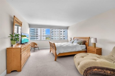 Huge 2/2.5 sundrenched corner unit sits at the canopy of the