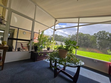 Welcome to this beautifully maintained 1990 double-wide