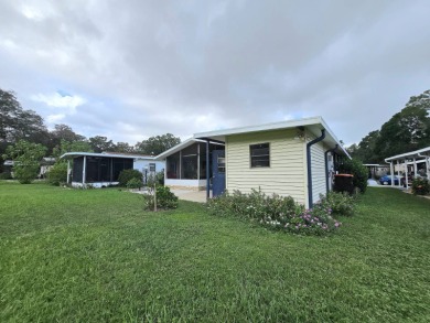 Welcome to this beautifully maintained 1990 double-wide