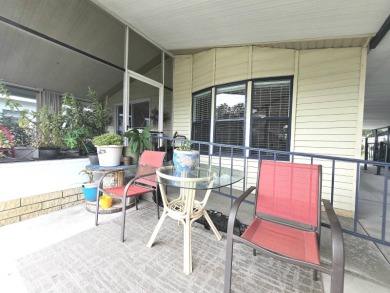 Welcome to this beautifully maintained 1990 double-wide