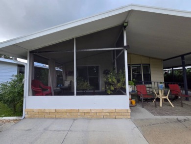 Welcome to this beautifully maintained 1990 double-wide