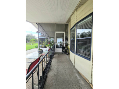 Welcome to this beautifully maintained 1990 double-wide