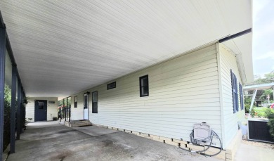 Welcome to this beautifully maintained 1990 double-wide