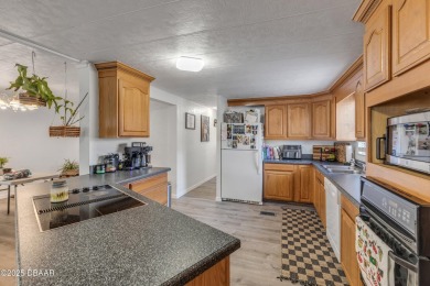 This intracoastal access canal front home presents endless