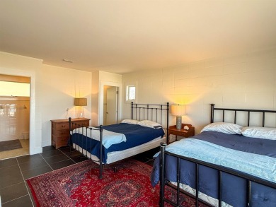 This charming ground level house on St. George Island offers the