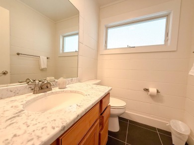 This charming ground level house on St. George Island offers the