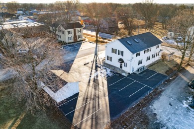 This real estate property comprises a three-unit building