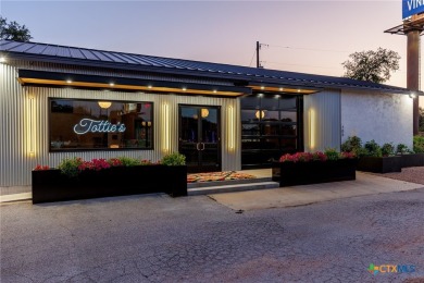 Discover a rare opportunity to own an established upscale bar