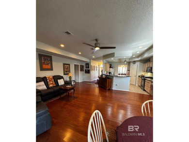 Welcome this charming coastal retreat with salt water pool in