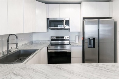 Step into luxury in this fully renovated 1 bed + den, 1.5 bath