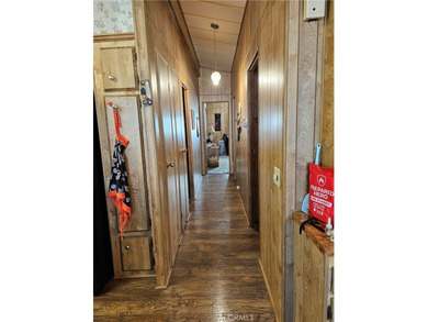 Perfectly situated on an oversized corner lot within the highly