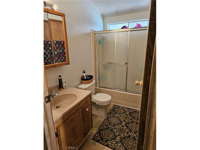 Perfectly situated on an oversized corner lot within the highly