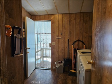 Perfectly situated on an oversized corner lot within the highly