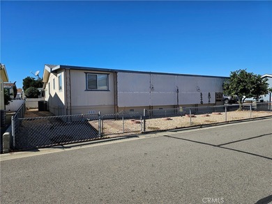 Perfectly situated on an oversized corner lot within the highly