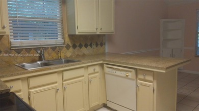 NICE HOUSE. The main level features three bedrooms, two