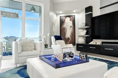 Perched at the very end of Bay Beach Lane, this exceptional