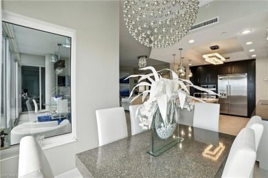 Perched at the very end of Bay Beach Lane, this exceptional