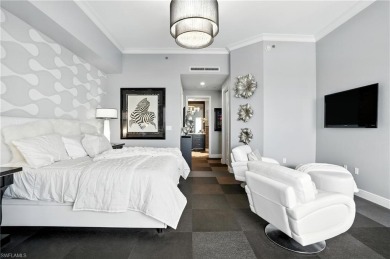 Perched at the very end of Bay Beach Lane, this exceptional