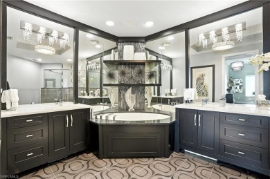 Perched at the very end of Bay Beach Lane, this exceptional