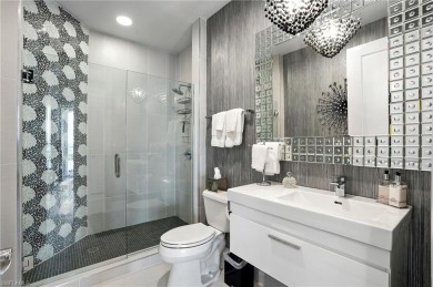 Perched at the very end of Bay Beach Lane, this exceptional