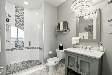 Perched at the very end of Bay Beach Lane, this exceptional