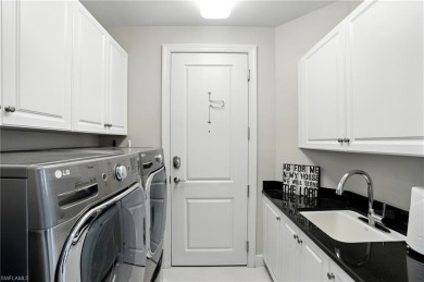 Perched at the very end of Bay Beach Lane, this exceptional