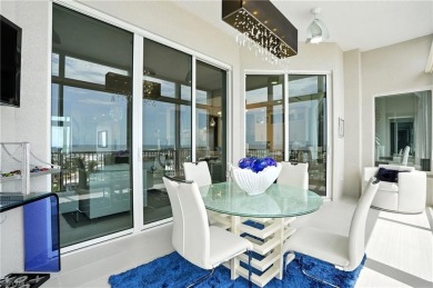 Perched at the very end of Bay Beach Lane, this exceptional